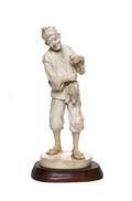 A Japanese Ivory Carving of a Fisherman