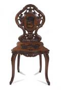 A Black Forest Carved and Marquetry Decorated Side Chair