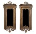 A Pair of Louis XVI Style Metal Mounted Mirrors