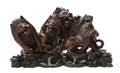 A Carved Wood Figural Group of Lions