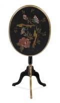 An Ebonized and Parcel Gilt TiltTop Tea Table