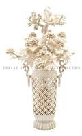 A Chinese Ivory Carving of a Bouquet of Flowers in a Basket