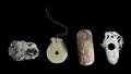 A Collection of Four Jade Hooks and Toggles