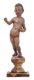 A Carved and Polychrome Decorated Santos Figure