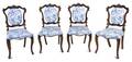 A Set of Four Baroque Style Carved Walnut Side Chairs