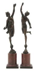 A Pair of Patinated Bronze Figures