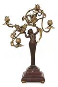 An Art Nouveau Patinated and Gilt Bronze Figural FourLight Candelabrum