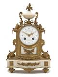 A Louis XVI Style Gilt Bronze and Marble Mantel Clock