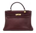 An Hermes Burgundy Leather Kelly Bag