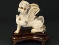 CARVED IVORY FIGURE OF A WINGED BEAST