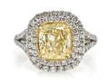 A Platinum 18 Karat Yellow Gold Fancy Yellow and White Diamond Ring