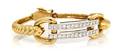 A 14 Karat Yellow Gold and Diamond Bangle Bracelet
