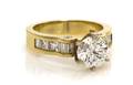 A 14 Karat Yellow Gold and Diamond Ring