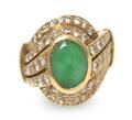 An 18 Karat Yellow Gold Jade and Diamond Ring