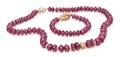 A Set of 14 Karat Yellow Gold Diamond and Ruby Bead Jewelry