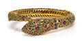 A Yellow Gold Ruby Emerald and Sapphire Serpent Bangle Bracelet