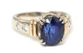 A 14 Karat Two Tone Gold Sapphire and Diamond Ring