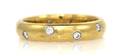 An 18 Karat Yellow Gold Platinum and Diamond Eternity Band Tiffany  Co