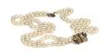 A Triple Strand Cultured Pearl Necklace