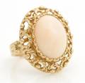 A 14 Karat Yellow Gold and Coral Ring