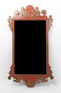 A Carved and Lacquered Mirror