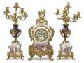 A Continental Porcelain and Gilt Bronze Mounted Clock Garniture