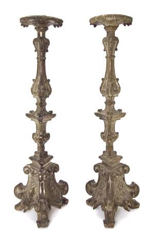 A Pair of Continental Carved Silvered Pricket Sticks