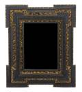 A Continental Ebonized and Faux Tortoise Shell Veneered Mirror