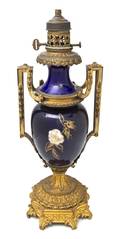 A Continental Gilt Bronze Mounted Porcelain Urn