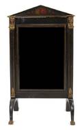 An Egyptian Revival Ebonized Dressing Mirror