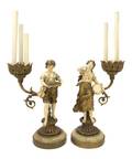 A Pair of Continental Figural ThreeLight Candelabrum
