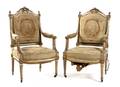 A Pair of Louis XVI Style Painted and Parcel Gilt Fauteuils