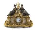 A French Gilt and Patinated Bronze Figural Mantel Clock