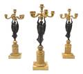 A Set of Three Empire Style Gilt and Patinated Bronze SixLight Candelabra