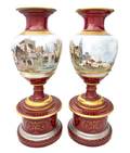 A Pair of Continental Porcelain Urns on Stands
