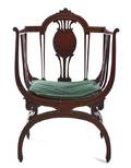 An Edwardian Mahogany Open Armchair
