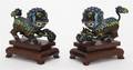 A Pair of Polychrome Enameled Fu Dogs