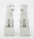 A Pair of Chinese Blanc de Chine Dogs