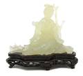A Chinese Carved Celadon Jade Figure