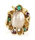 A 14 Karat Yellow Gold Moonstone Ruby and Emerald Ring