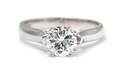 An 18 Karat White Gold and Diamond Solitaire Ring