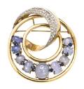 A 14 Karat Yellow Gold Sapphire and Diamond Circular Brooch