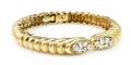 A 14 Karat Yellow Gold and Diamond Bangle Bracelet
