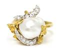An 18 Karat Yellow Gold Cultured Pearl and Diamond Ring