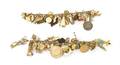 A Group of 14 Karat Yellow Gold Charm Bracelets with Numerous Attached Vintage Charms