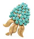 A 14 Karat Yellow Gold Turquoise and Diamond Brooch