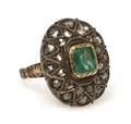 A Silver Topped Gold Emerald and Diamond Ring