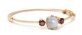 An Antique Yellow Gold Star Sapphire and Garnet Bangle Bracelet