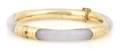 A 14 Karat Yellow Gold and Lavender Jade Hinged Bangle