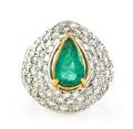 A Platinum 18 Karat Yellow Gold Emerald and Diamond Ring